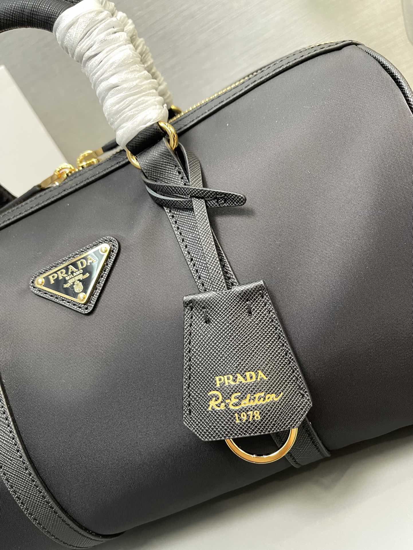 Prada Re Edition 1978 medium ReNylon And Saffiano Leather Top Handle Bag Black 1BB233